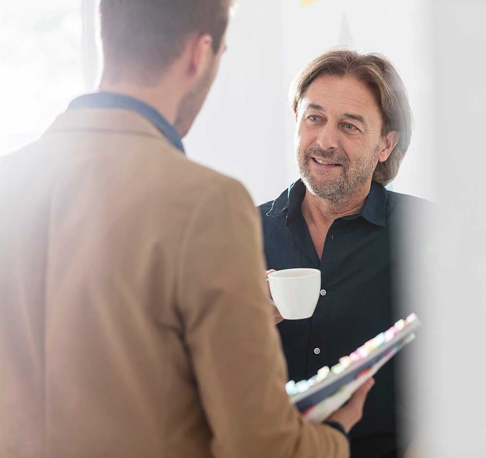 Two-stories-Business-over-Coffee-AdobeStock_612318702 Two-stories-Business-over-Coffee-AdobeStock_612318702